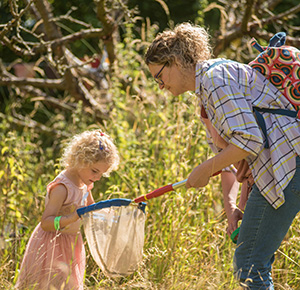 A girl goes bug-hunting with her mum